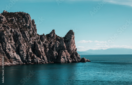 Big mountain on the blue sea background
