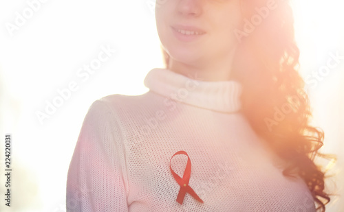 Wallpaper Mural The red ribbon of the girl. The girl is holding a red ribbon. He Torontodigital.ca