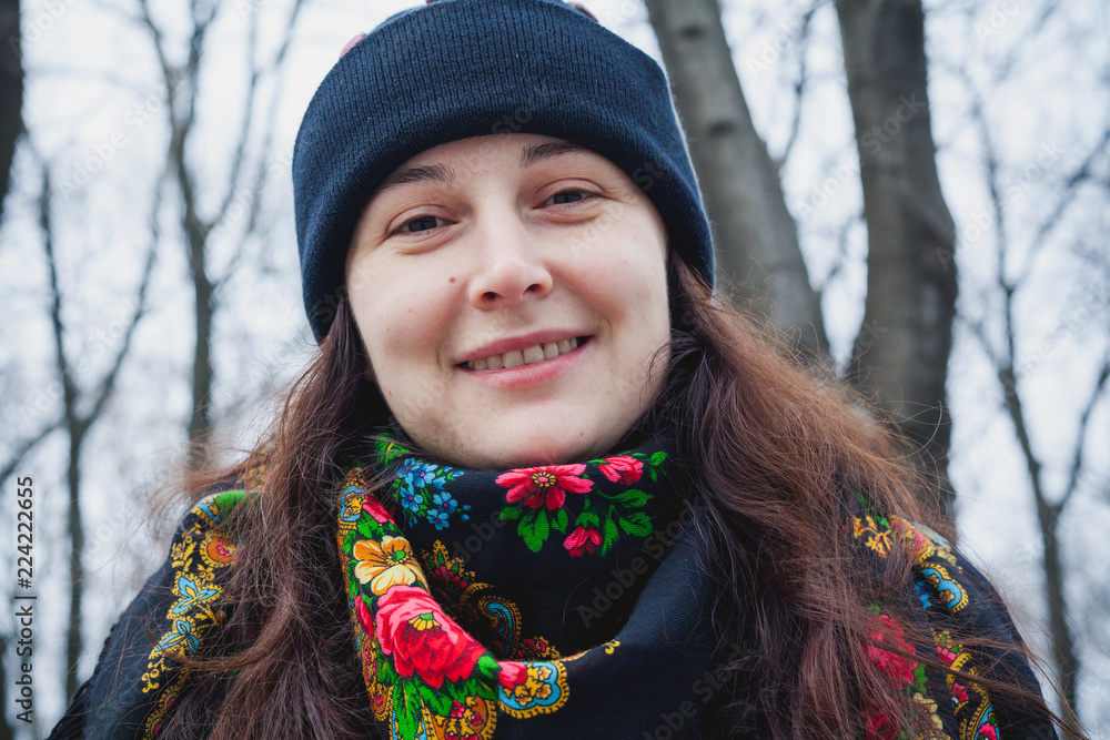 Beautiful girl in traditional Russian scarf on Spring Street Beautiful girl in traditional Russian scarf on Spring Street