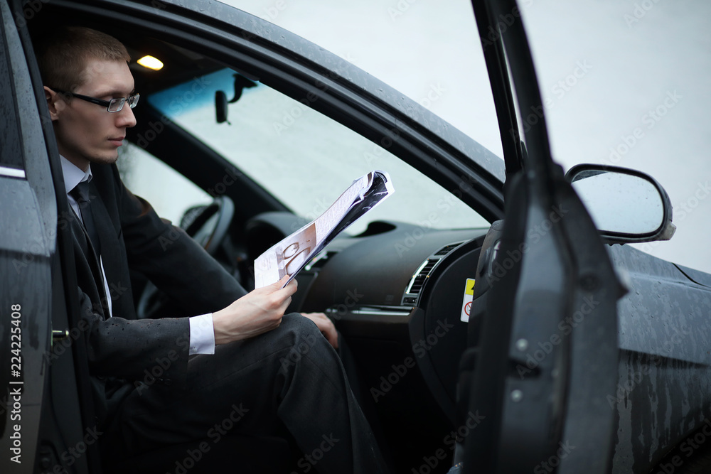 Man in a business suit in the car Man in a business suit in the car