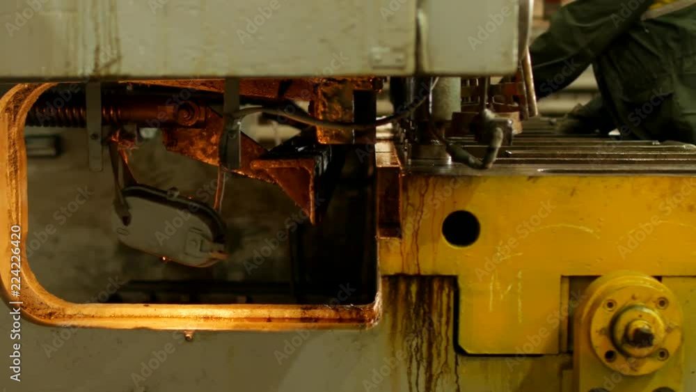 the worker is engaged in cutting of metal on the production automatic machine tool, metal cutting, processing the worker is engaged in cutting of metal on the production automatic machine tool, metal cutting, processing