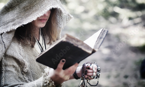 Fairy magician. A sorcerer with a glass sphere, a magical spell  photo