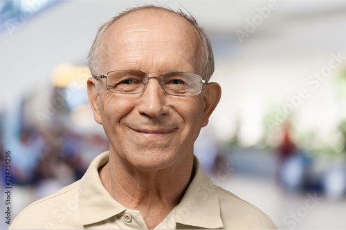 Happy senior man in glasses