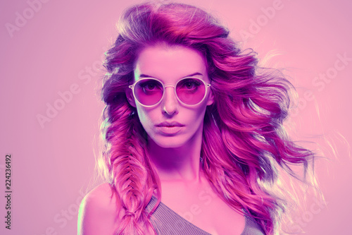 Fashion neon light. Girl with glowing Hairstyle