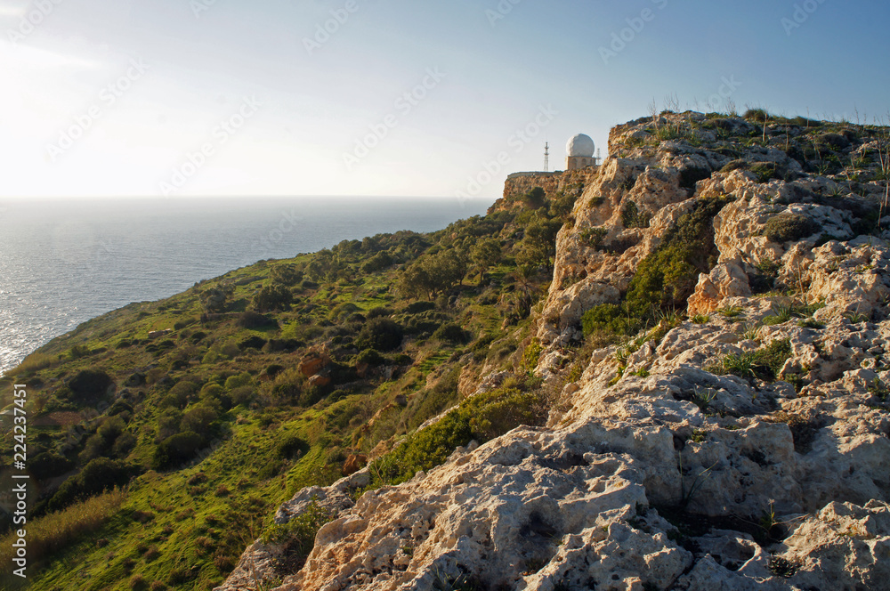 Dingli Cliffs with Dingli Aviation Radar building in the sunset, Malta