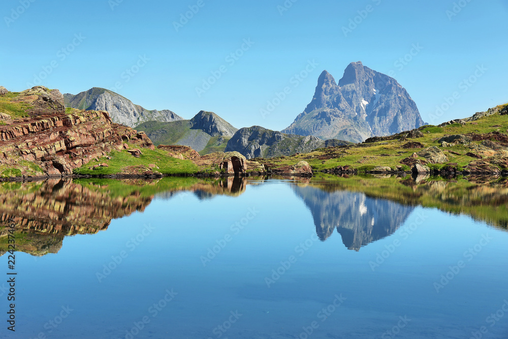 Pic du Midi d Ossau reflecting in Anayet lake, Spanish Pyrenees, Aragon, Spain