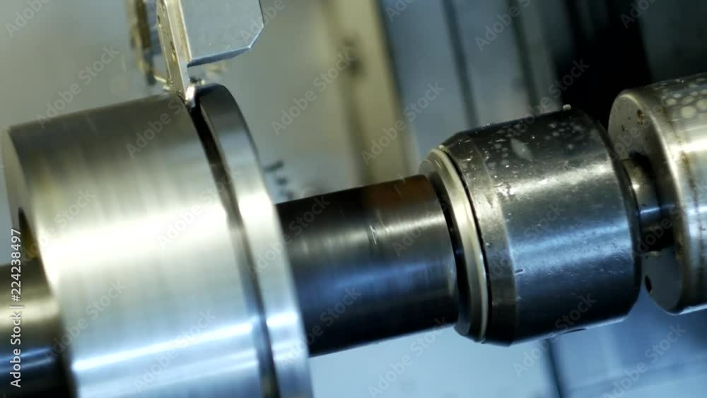 CNC lathe pulls out part of metal workpiece pulley, modern lathe for metal processing, close-up, tooling CNC lathe pulls out part of metal workpiece pulley, modern lathe for metal processing, close-up, tooling
