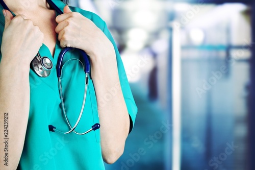 Schilderij op canvas Young woman docotor with stethoscope