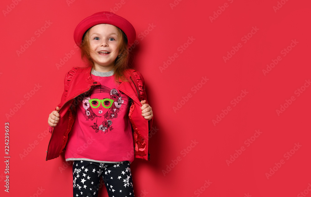 Five years old baby girl child kid posing in red leather jacket and hat screaming yelling Five years old baby girl child kid posing in red leather jacket and hat screaming yelling