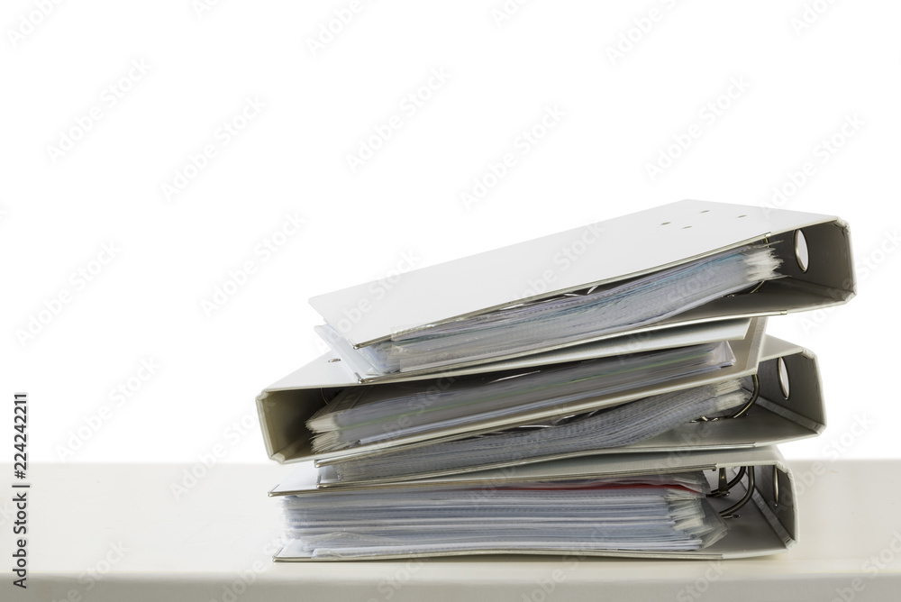 stack of folders on a desk isolated on a white background, business and finance concept, copy space stack of folders on a desk isolated on a white background, business and finance concept, copy space