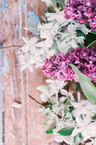 Blooming lilac on a wooden old background