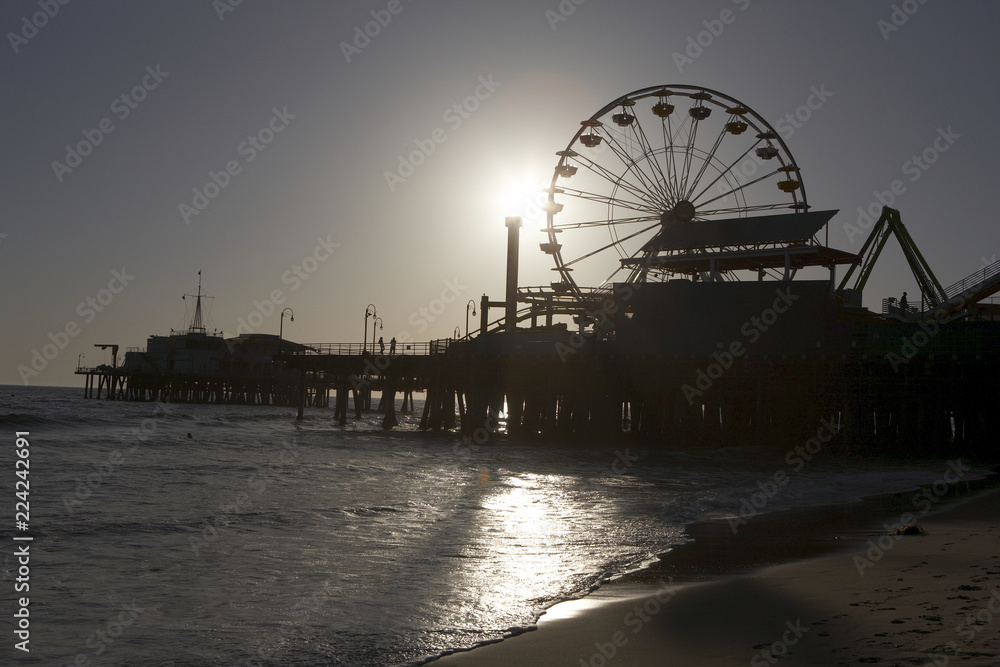 Ferris wheel on pier at dusk Ferris wheel on pier at dusk