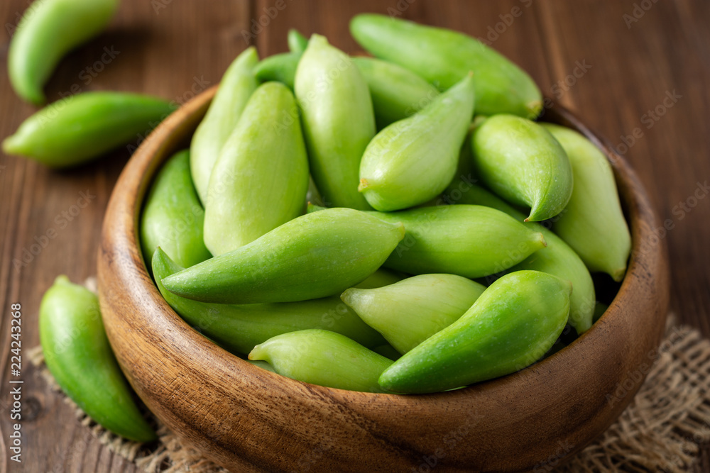 Cyclanthera pedata or kaywa or caigua or achuqcha - Latin American vegetable in bowl on wooden background. Selective focus. Cyclanthera pedata or kaywa or caigua or achuqcha - Latin American vegetable in bowl on wooden background. Selective focus.