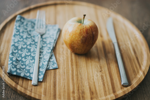 A beautiful red apples on a wooden background.