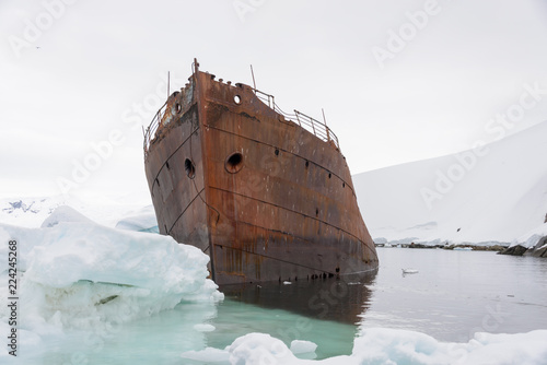 Old rusty wreck in Antarctica photo