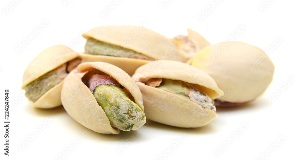 Heap of pistachios nuts isolated om the white Heap of pistachios nuts isolated om the white