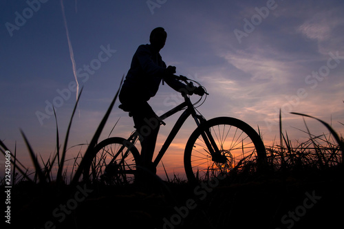 Man on bike, bicycle at sunset