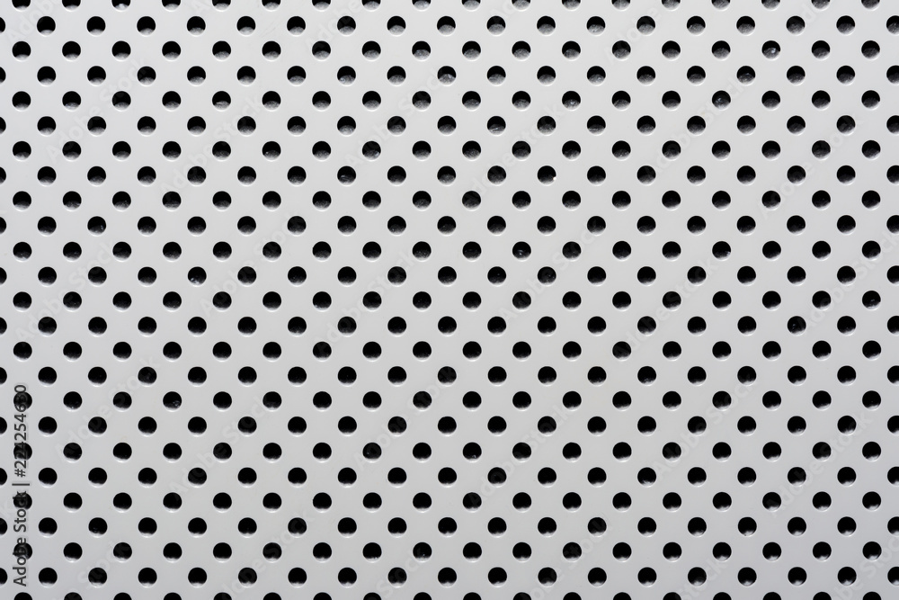 gray abstract background on based of metal, circles and shadows, texture of the white surface with a lot of round holes gray abstract background on based of metal, circles and shadows, texture of the white surface with a lot of round holes