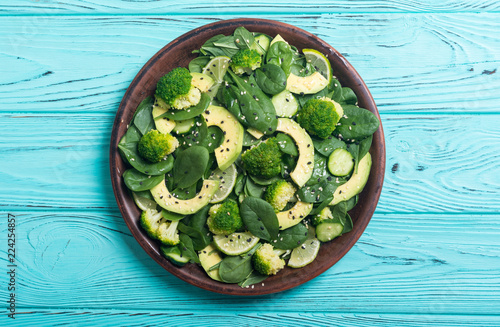 Green baby spinach salad with avocado