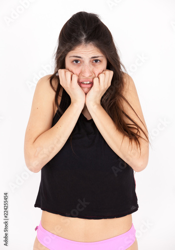 Fear emotional girl on a light background photo