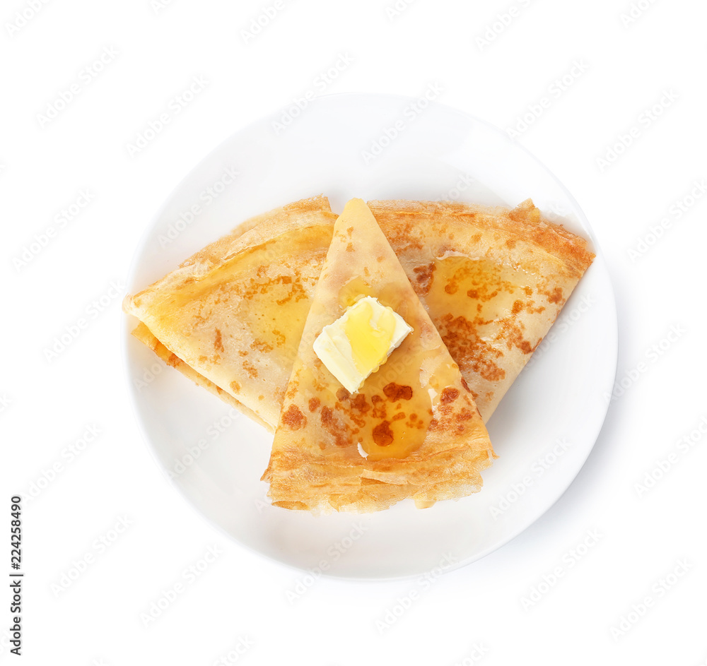 Tasty thin folded pancakes with butter and honey on plate against white background, top view Tasty thin folded pancakes with butter and honey on plate against white background, top view