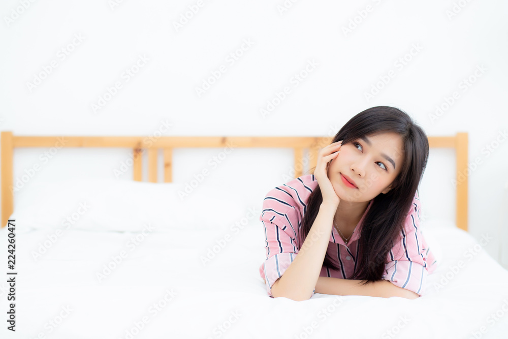 Beautiful portrait young asian woman lying and smile while wake up with sunrise at good morning, girl with happy, lifestyle and relax concept. Beautiful portrait young asian woman lying and smile while wake up with sunrise at good morning, girl with happy, lifestyle and relax concept.