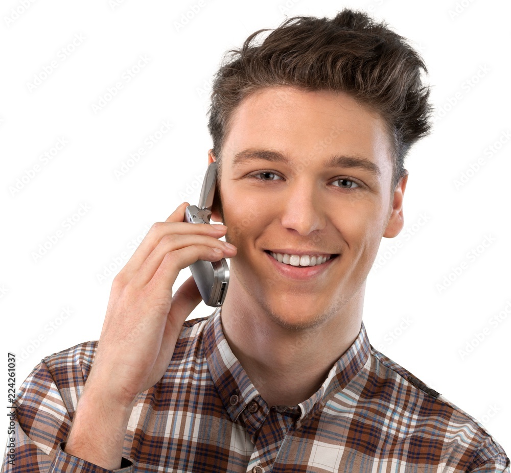 Young man talking on his cell phone Young man talking on his cell phone