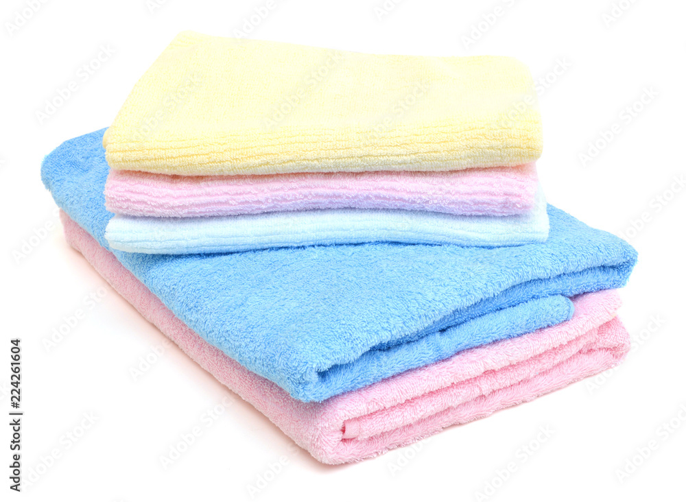 stacked colorful towels on a white background stacked colorful towels on a white background