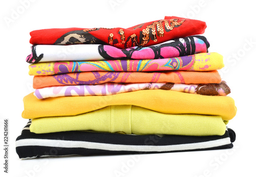Pile of coloured clothes from the laundry - isolated on white