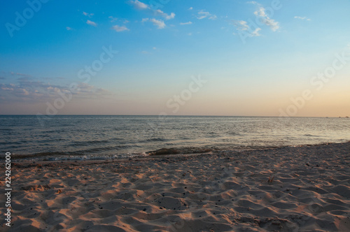Warm blue sunset on the shore of the ocean, the sea, at sunset on a summer