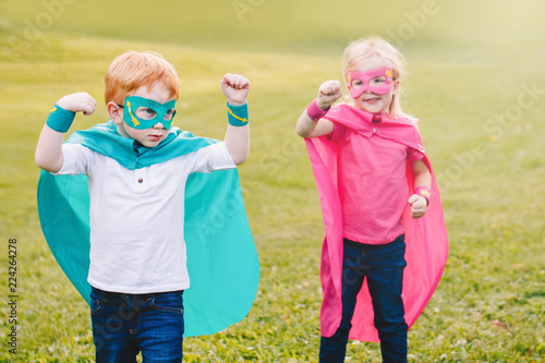 Фотография Cute adorable preschool Caucasian children playing superheroes