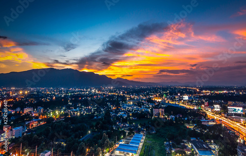 CHIANG MAI, THAILAND- AUGUST 7, 2018 : Aerial Panorama View of Chiang Mai City with sunset and twilight sky. © somchairakin