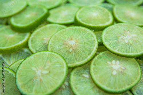 Citrus fruit of lime slices background