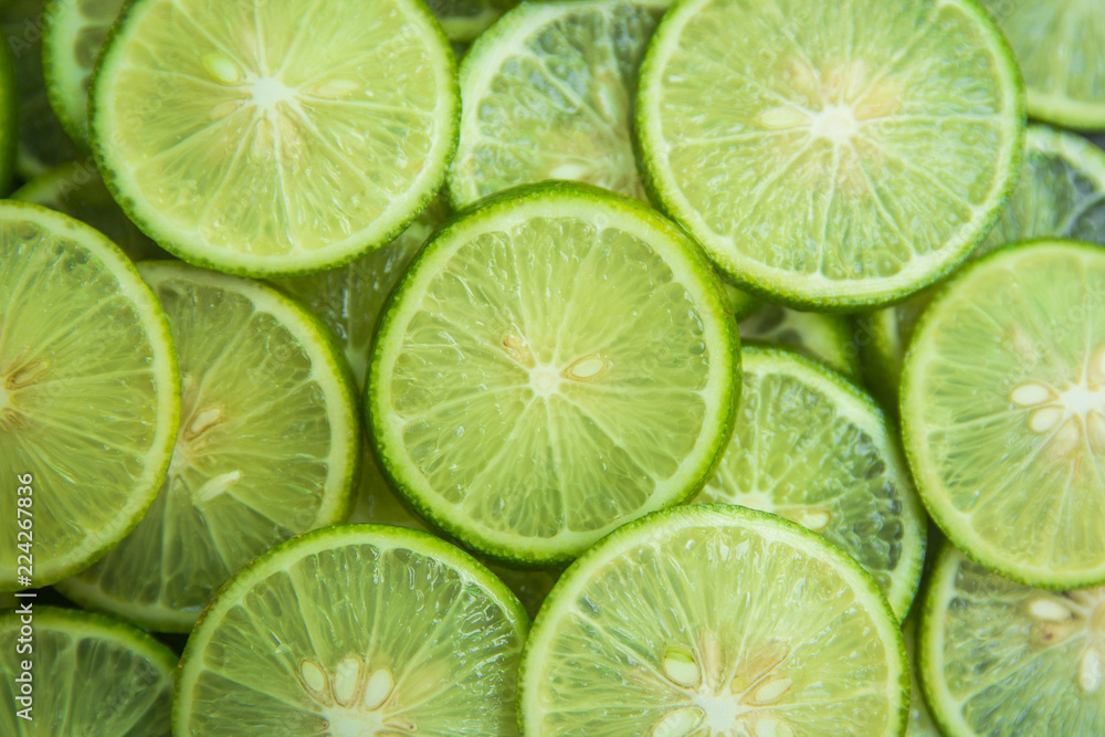 Citrus fruit of lime slices background Citrus fruit of lime slices background