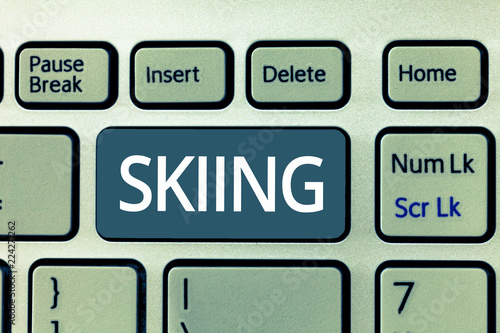 Text sign showing Skiing. Conceptual photo action of travelling over snow skis especially as sport or recreation. photo