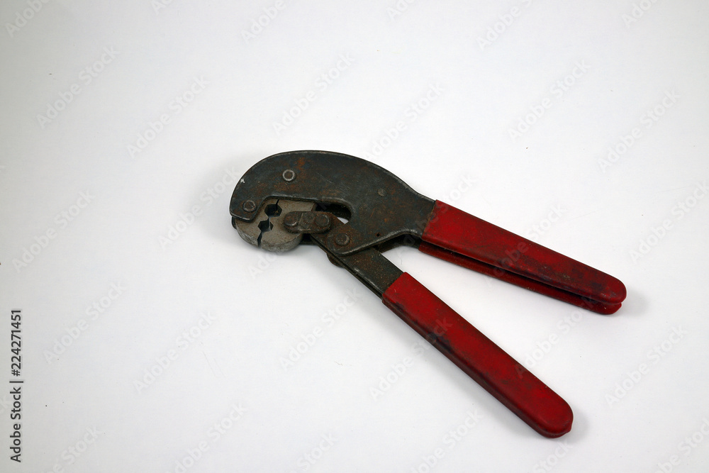 Crimping pliers, old used, on white background Crimping pliers, old used, on white background