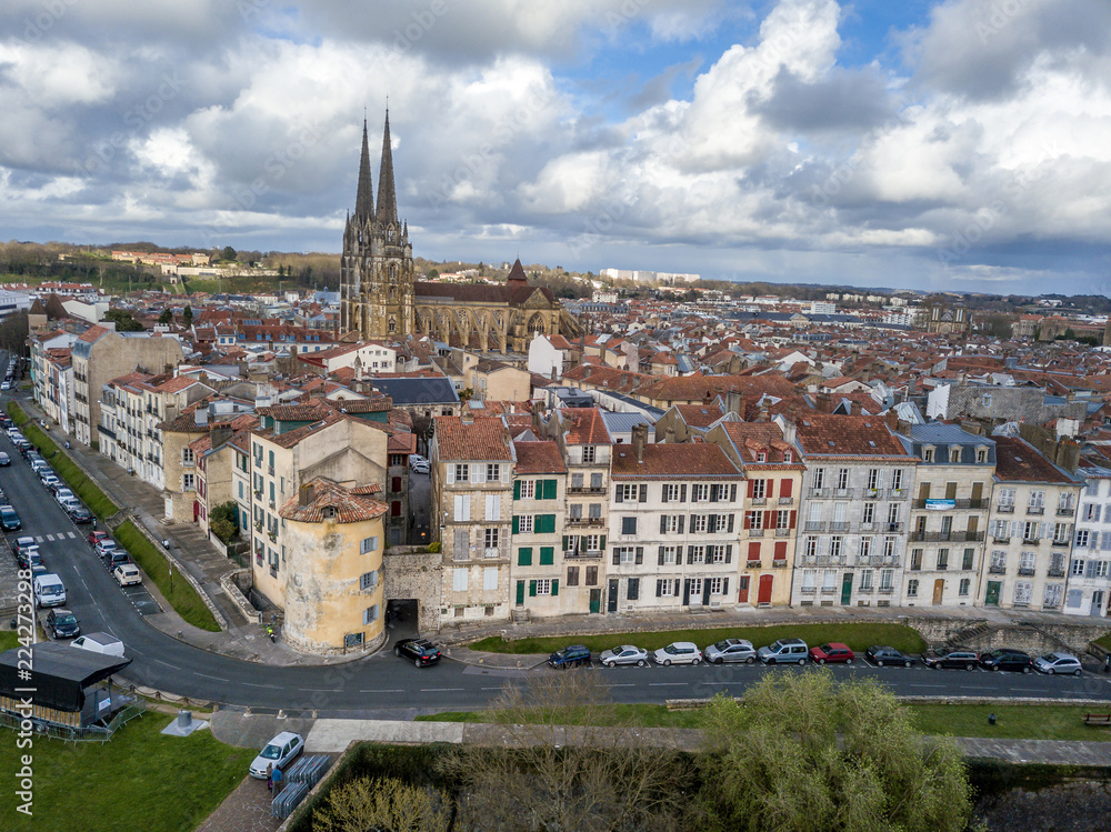 Aerial panorama view of Bayonne France with the medieval cathedral, colorful traditional French houses stormy cloudy sky in the background