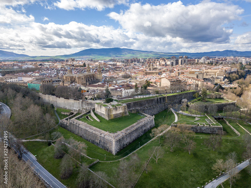 Aerial panorama view of fortified medieval Pamplona in Spain with dramatic cloudy blue sky