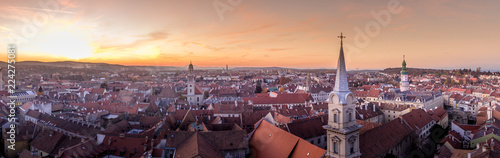 Aerial sunset view of medieval Sopron with church and red roof houses photo