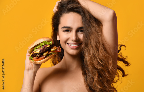 Wallpaper Mural Woman hold big barbecue burger sandwich with hungry mouth happy screaming laughing on yellow background Torontodigital.ca