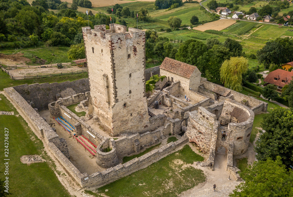 Aerial view of famous medieval Kinizsi castle ruin in rural Hungary with donjon, chapel and barbican