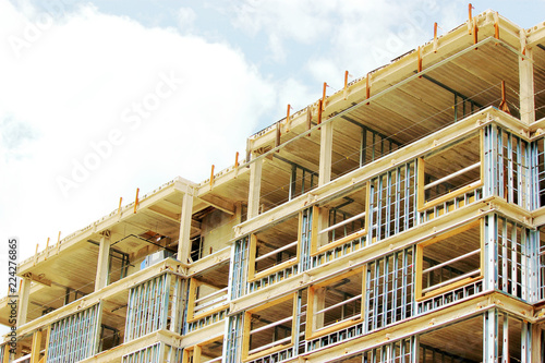 Contruction site of residential building on blue sky background