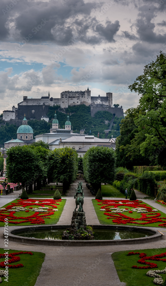 Naklejka premium Panoramic view of Salzburg with castle, cathedrl and dramatic sky 