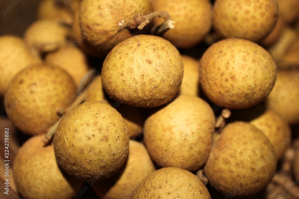 Longan fruits or Dimocarpus longan or Dragon eye fruit on the wooden wicker. Longan fruits or Dimocarpus longan or Dragon eye fruit on the wooden wicker.