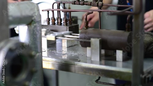 Electric water pumping machine running. Inside a workshop. photo