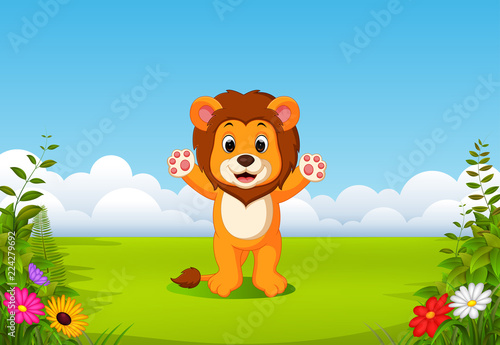 the beautiful view with the little lion waving his hand in the field   