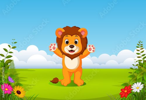 Fototapeta Naklejka Na Ścianę i Meble -  the beautiful view with the little lion waving his hand in the field 
