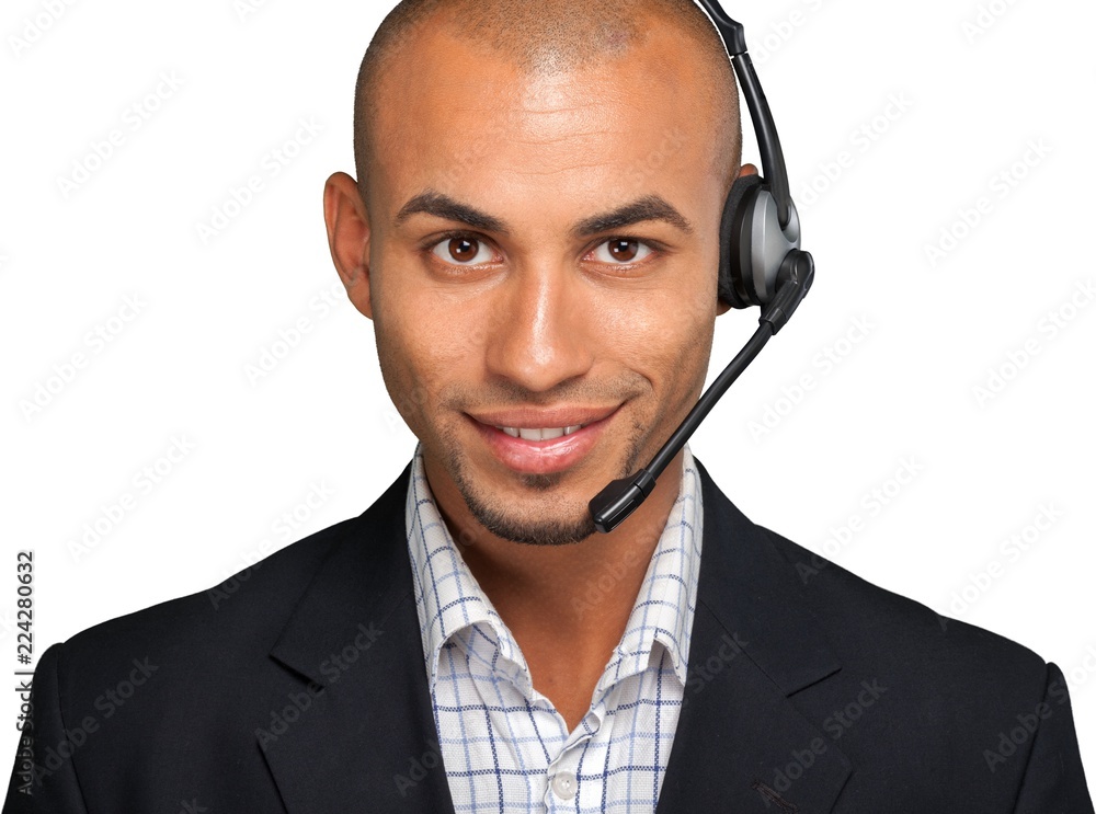 Portrait of a smiling man with headset working as a call center Portrait of a smiling man with headset working as a call center