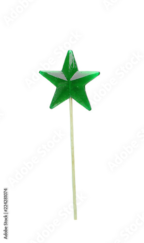Homemade lollipop. Green star shaped lollipop isolated.