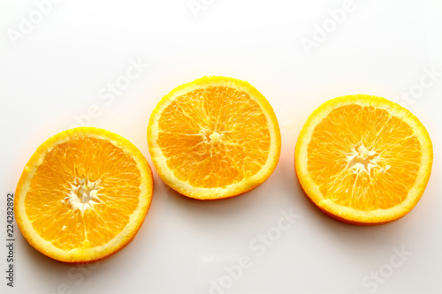 Orange Slice on white background   Orange is a citrus fruit that is quite delicious  juicy with high content Vitamin C. 